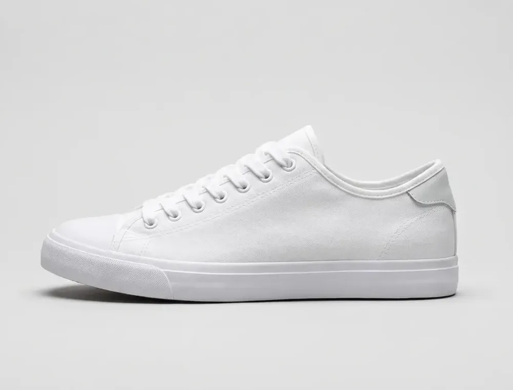 The same white trainer clean after a gentle machine wash in the bag